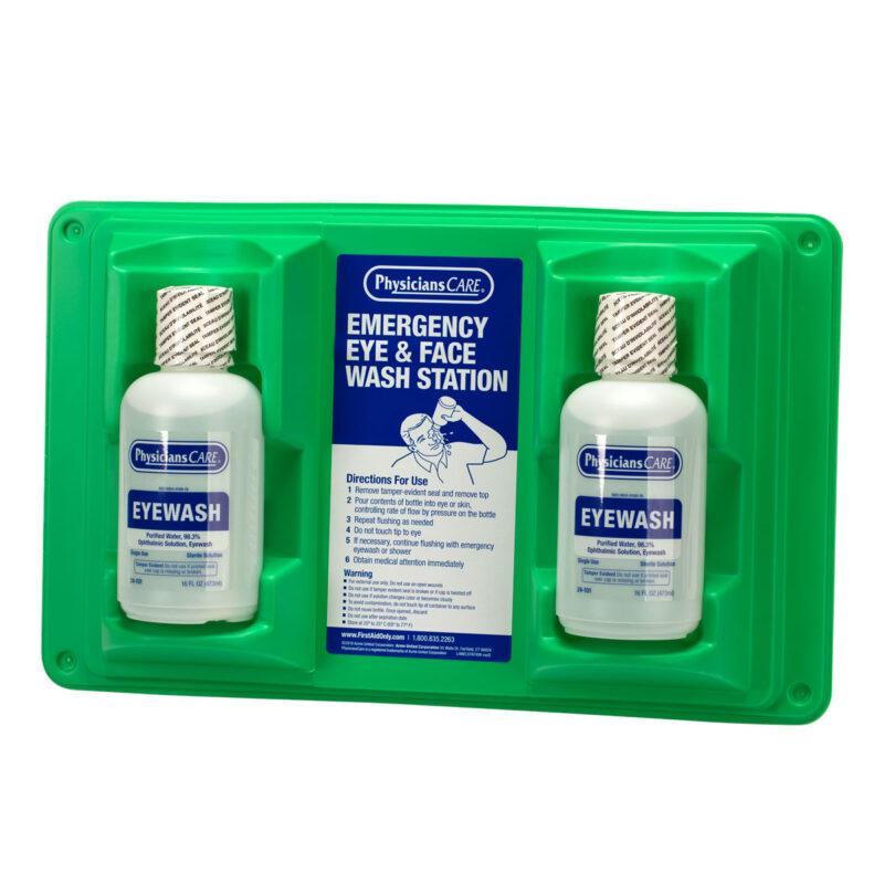 A green first aid kit with emergency eye and face wash bottles.