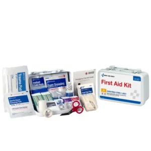 A first aid kit with various medical supplies spread out.