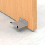 Door foot pull handle on floor.