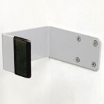 White wall bracket with black pad.