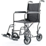 Lightweight transport wheelchair with footrests.