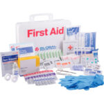 First aid kit with medical supplies displayed.