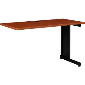 A wooden desk top with a single black metal leg.